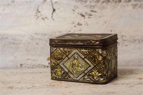 Vintage metal storage box with hinged lid 